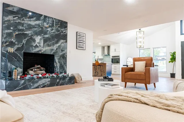 a bed room with a bed furniture and a fireplace