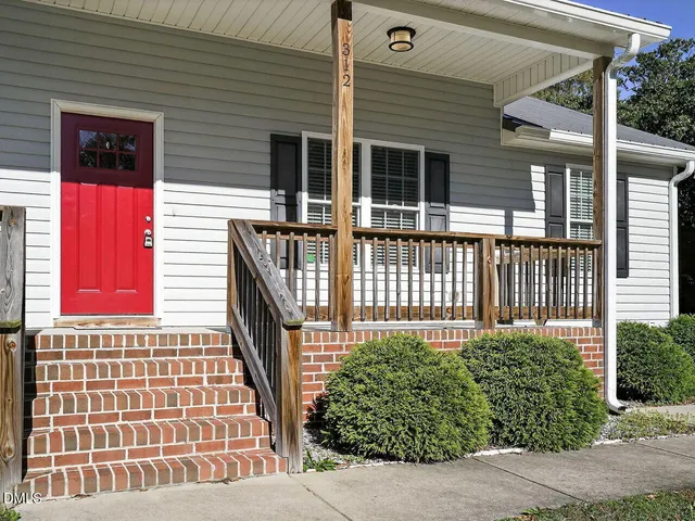 a view of a house with porch and wooden floor