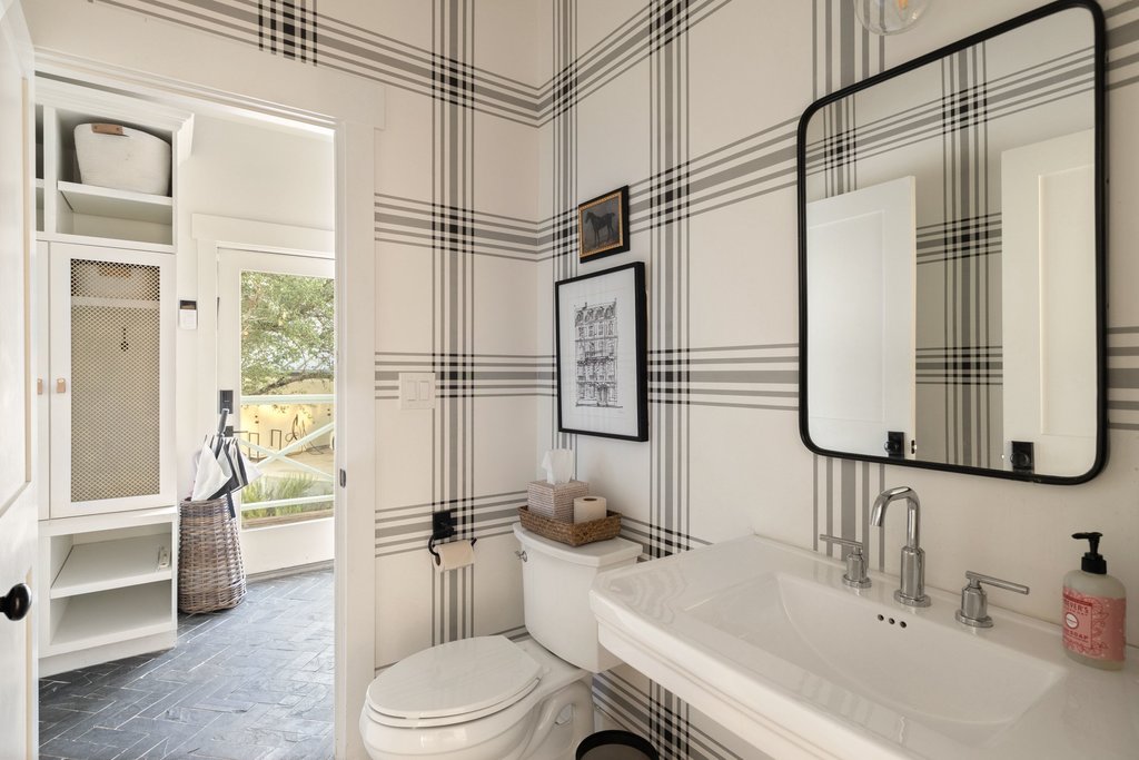 32045 Mirela Ann Road Dripping Springs, TX 78620 - Photo 13 of 30 Bold plaid walls pair beautifully with timeless fixtures in this stylish half bath.