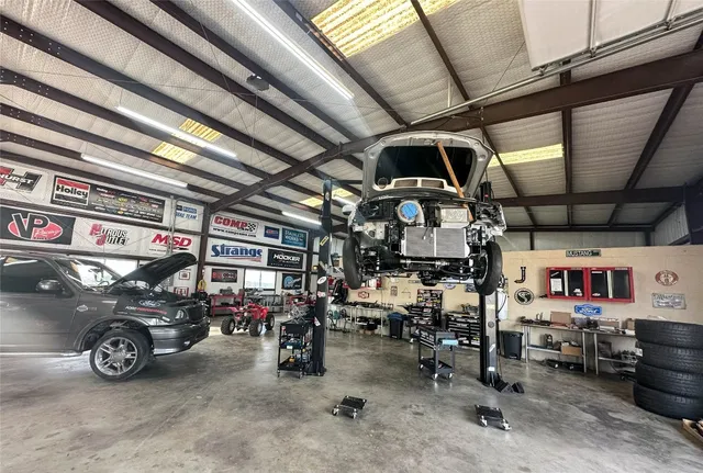 a view of parking garage with cars