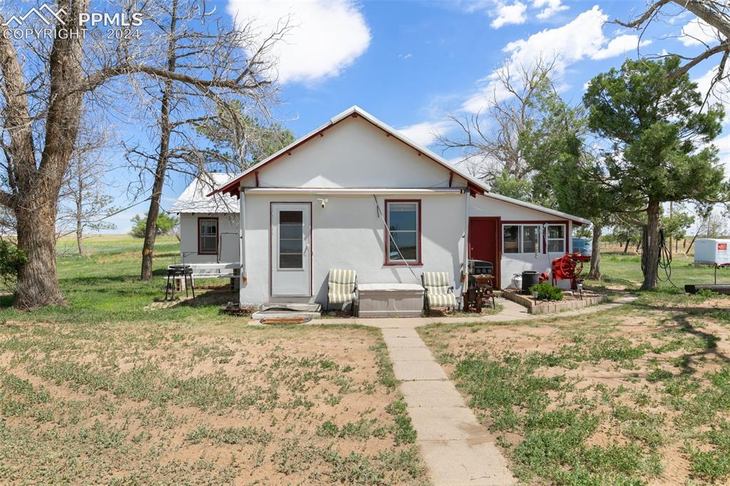 40150 Rapp Road Rush, CO 80833 - Photo 2 of 39 a view of a house with backyard and trees