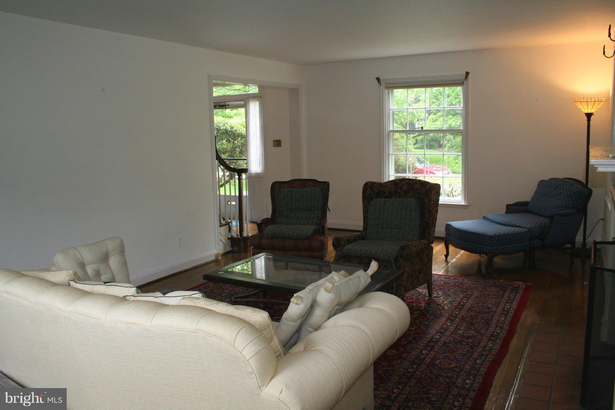 115 Enfield Road Baltimore, MD 21212 - Photo 11 of 37 Living Room opens to foyer & side porch