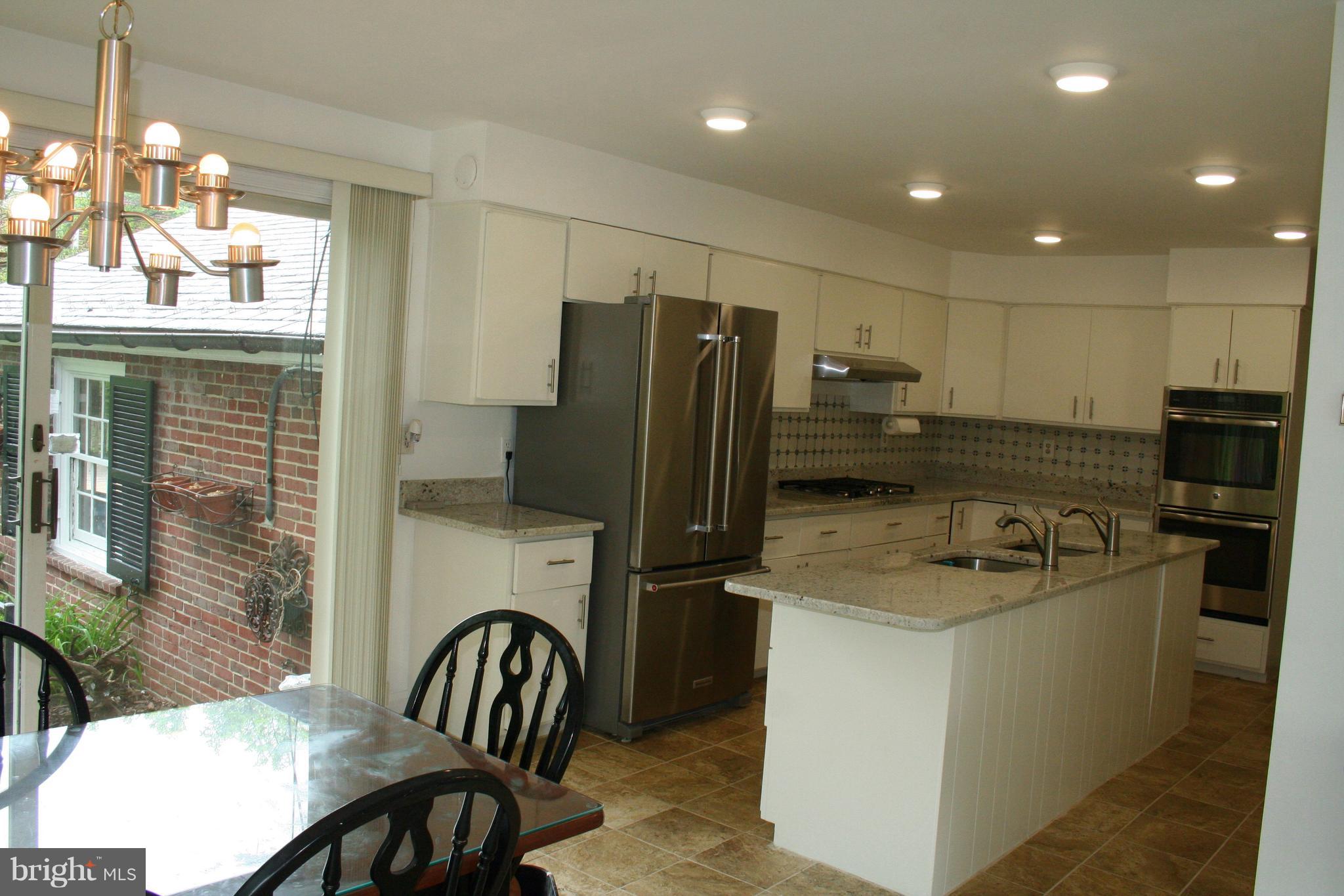 115 Enfield Road Baltimore, MD 21212 - Photo 17 of 37 Eat-in Kitchen with sliders to patio