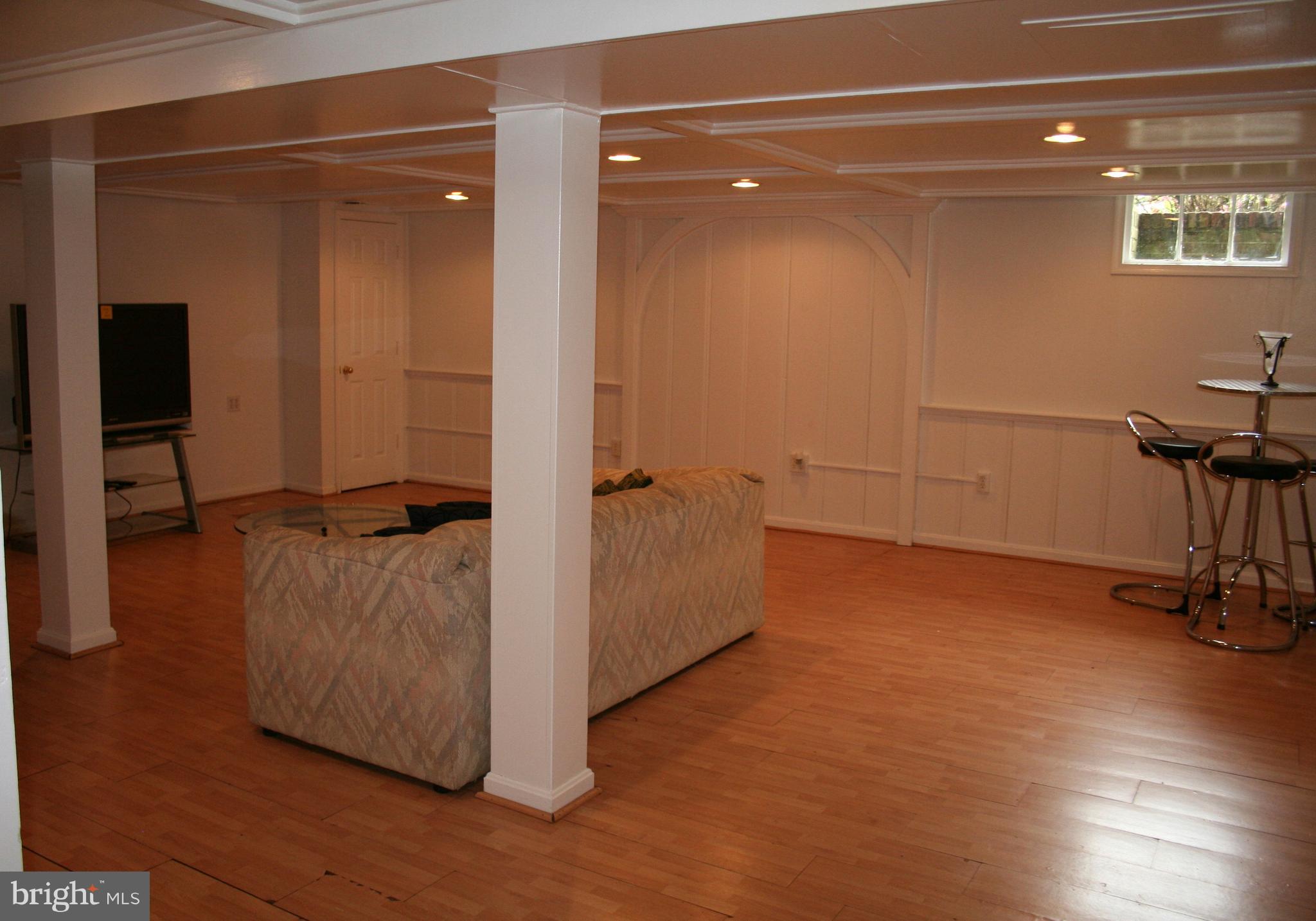 115 Enfield Road Baltimore, MD 21212 - Photo 29 of 37 Rec Room with easy-to-clean laminate flooring