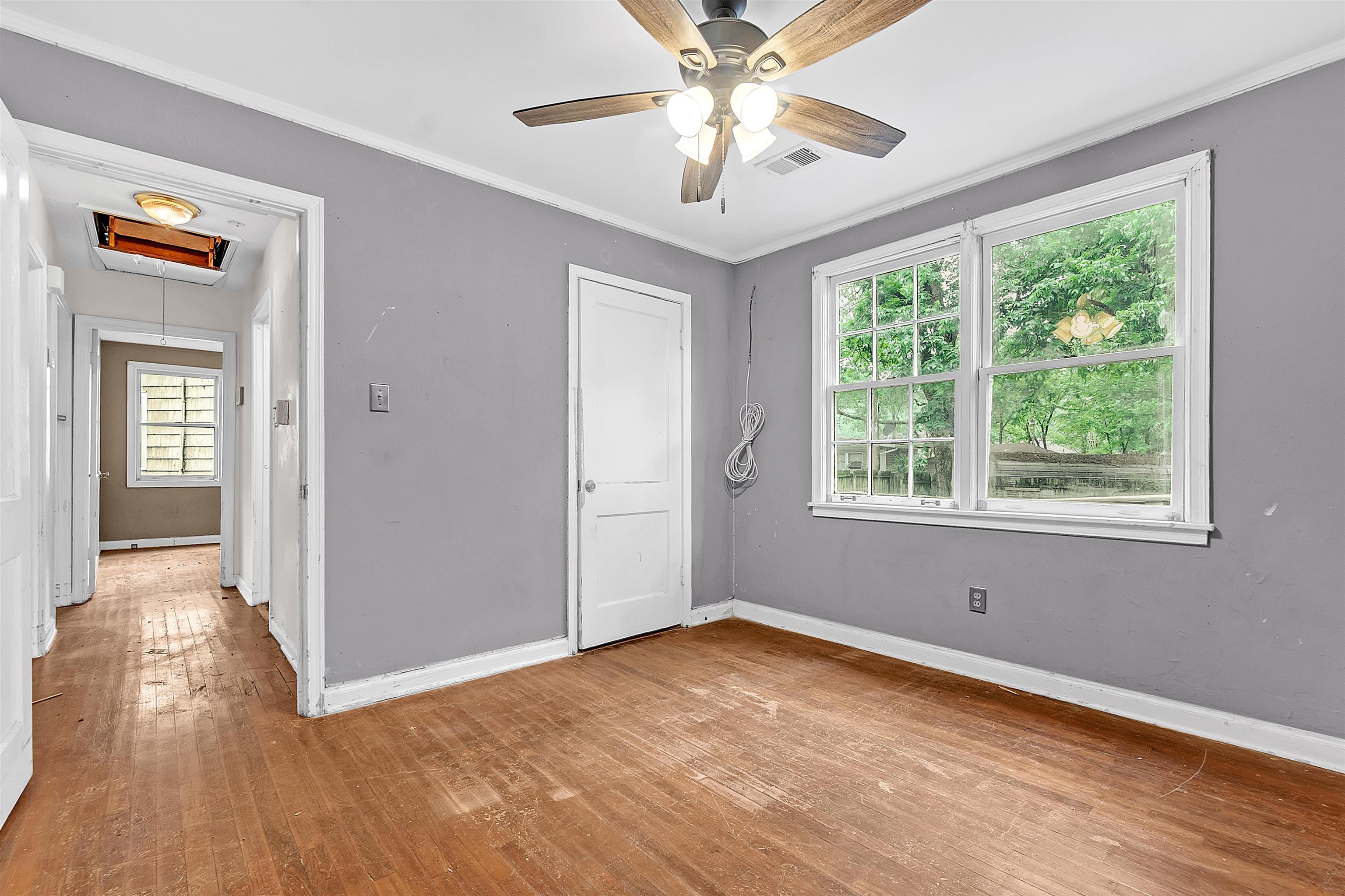 1013 Waring Road Memphis, TN 38122 - Photo 8 of 11 a view of empty room with wooden floor and fan