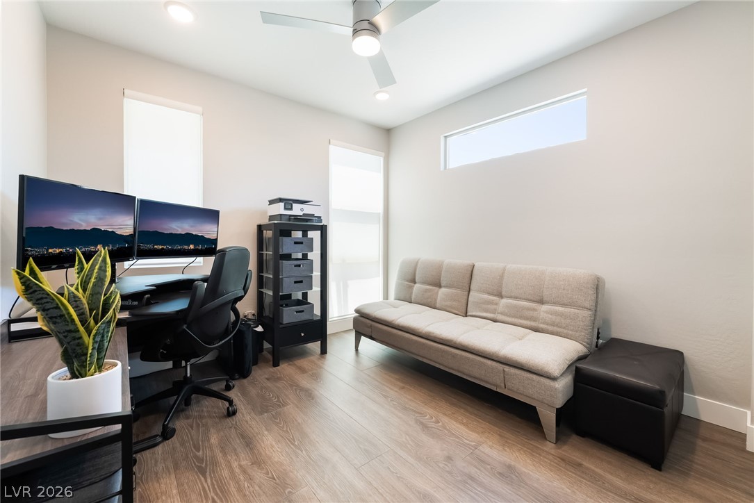 2166 Trivero Street Henderson, NV 89044 - Photo 16 of 61 A well-lit, versatile office space with rich wood flooring offers both productivity and relaxation.