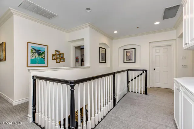 a view of a hallway with windows