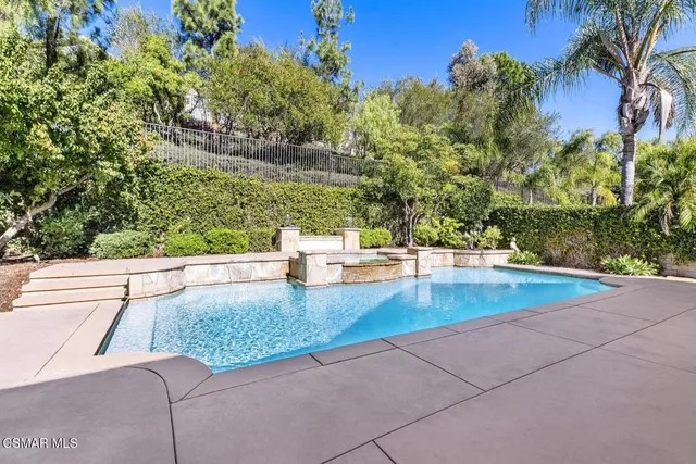 a view of swimming pool with a patio