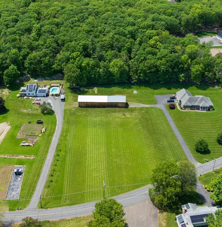 a view of a swimming pool with a yard