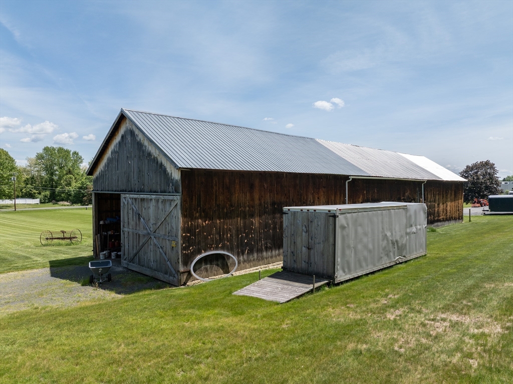 2 B Linseed Road Hatfield, MA 01088 - Photo 5 of 11 a backyard of a house with fireplace and outdoor seating