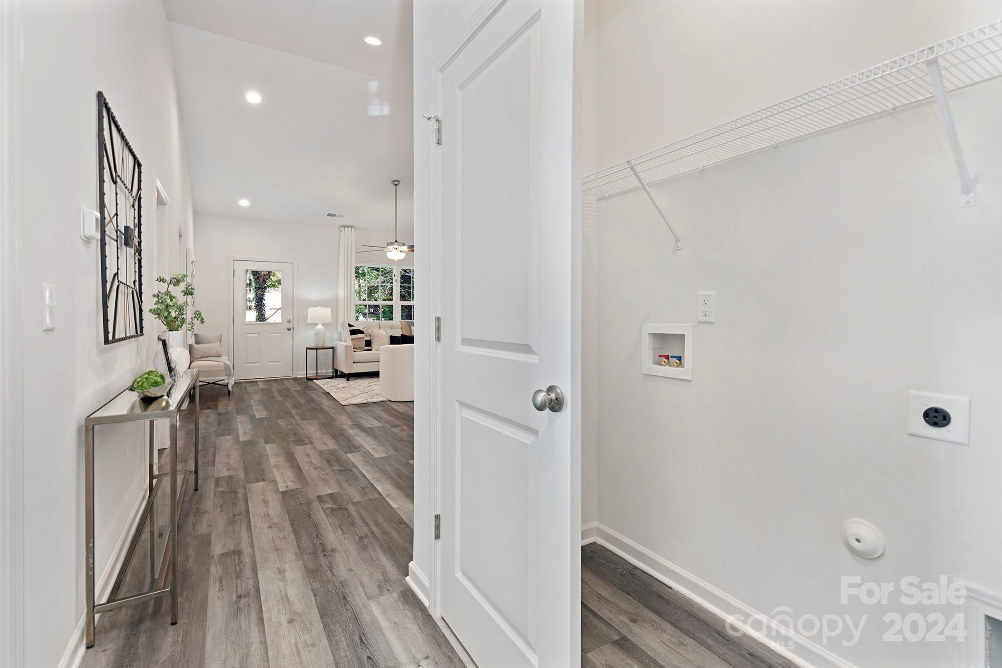2150 Sunset Boulevard Charlotte, NC 28269 - Photo 11 of 23 a view of a hallway with wooden floor and staircase