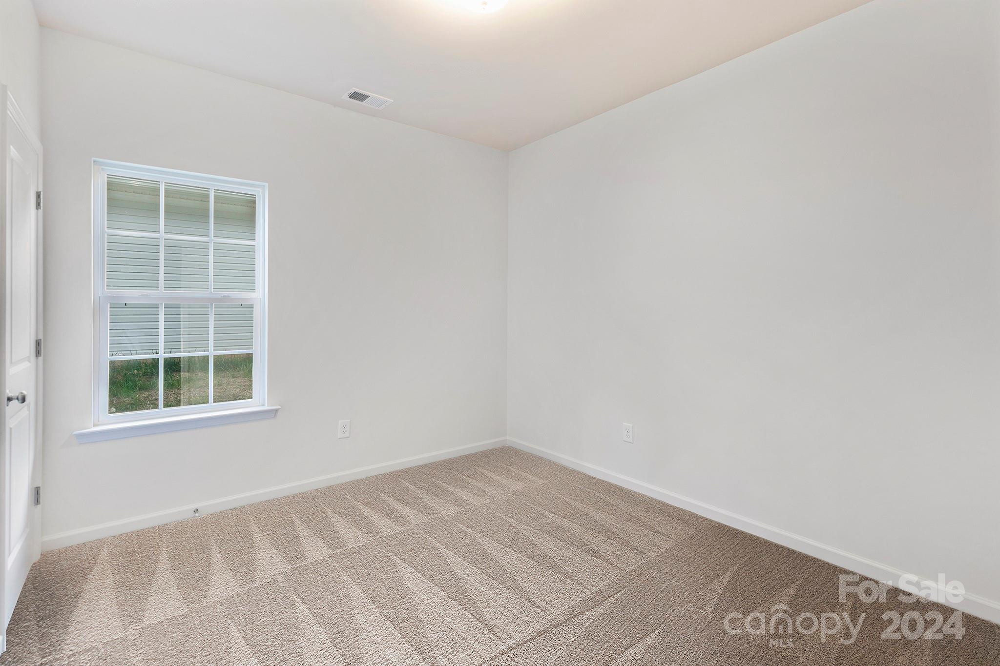 2150 Sunset Boulevard Charlotte, NC 28269 - Photo 15 of 23 an empty room with a window
