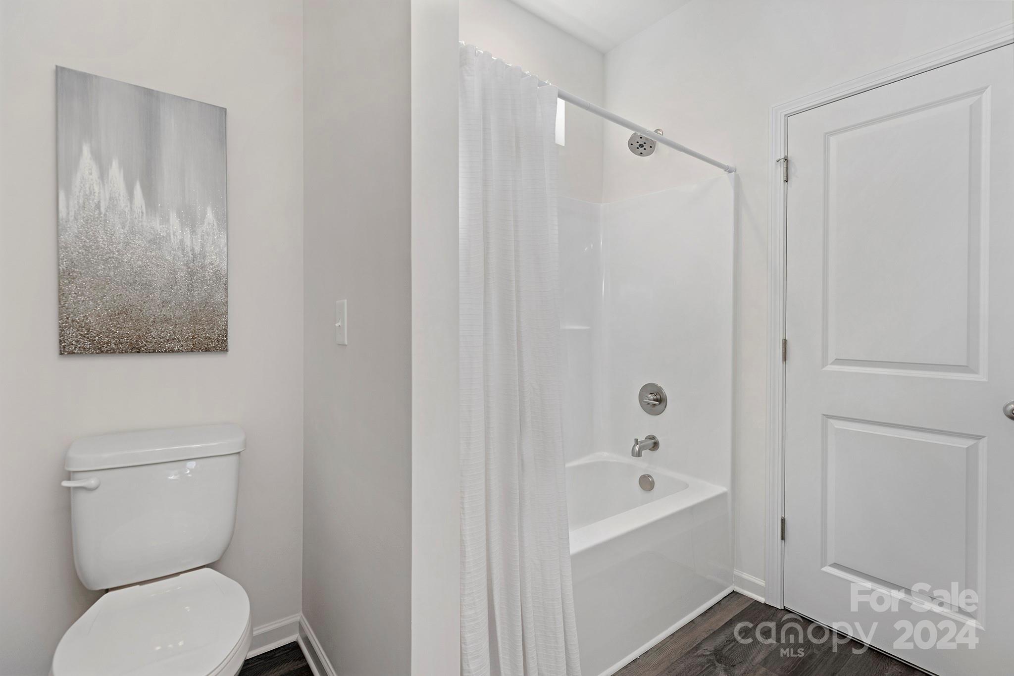 2150 Sunset Boulevard Charlotte, NC 28269 - Photo 18 of 23 a bathroom with a toilet and a bathtub