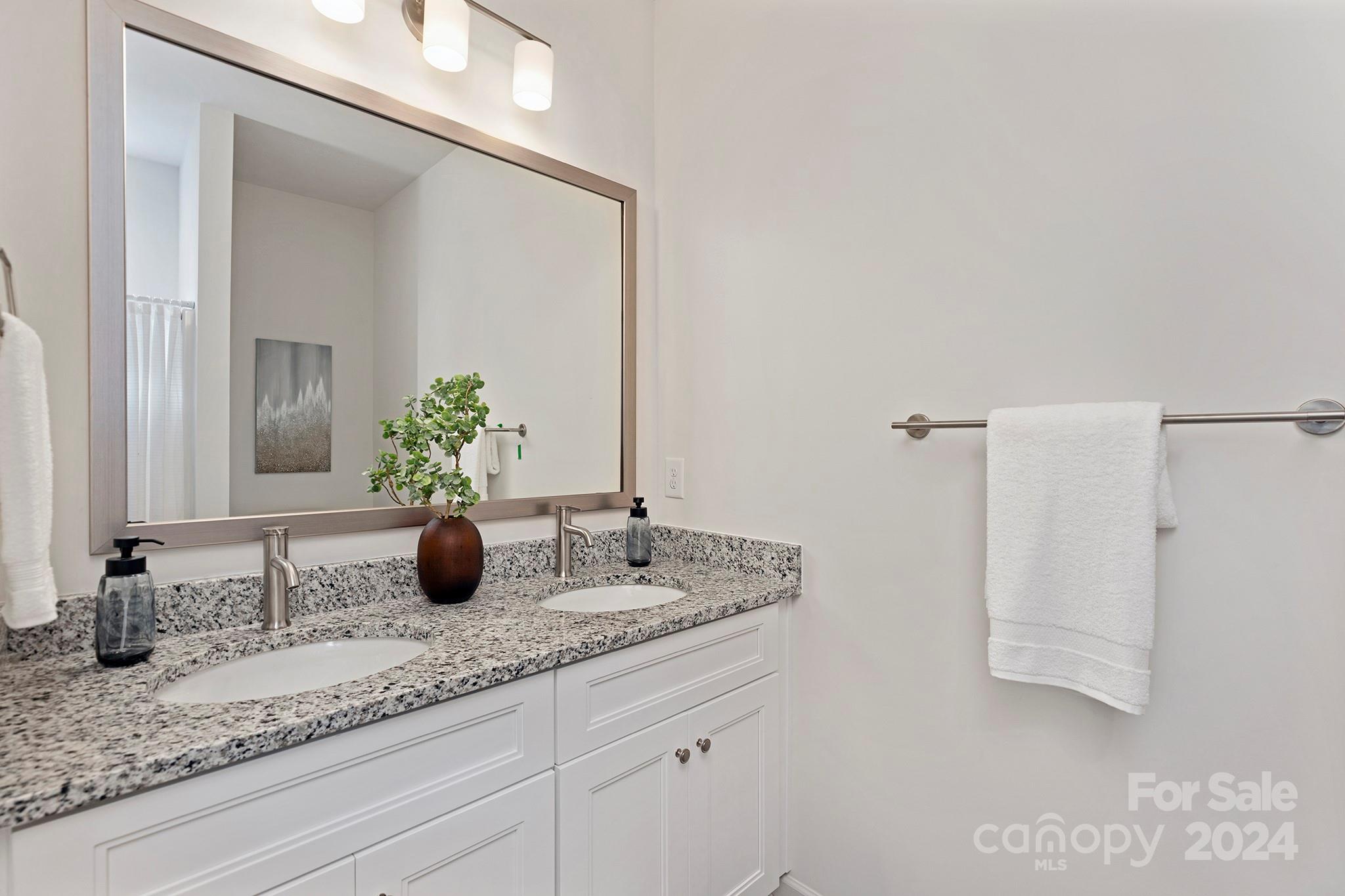 2150 Sunset Boulevard Charlotte, NC 28269 - Photo 19 of 23 a bathroom with a granite countertop sink and a mirror