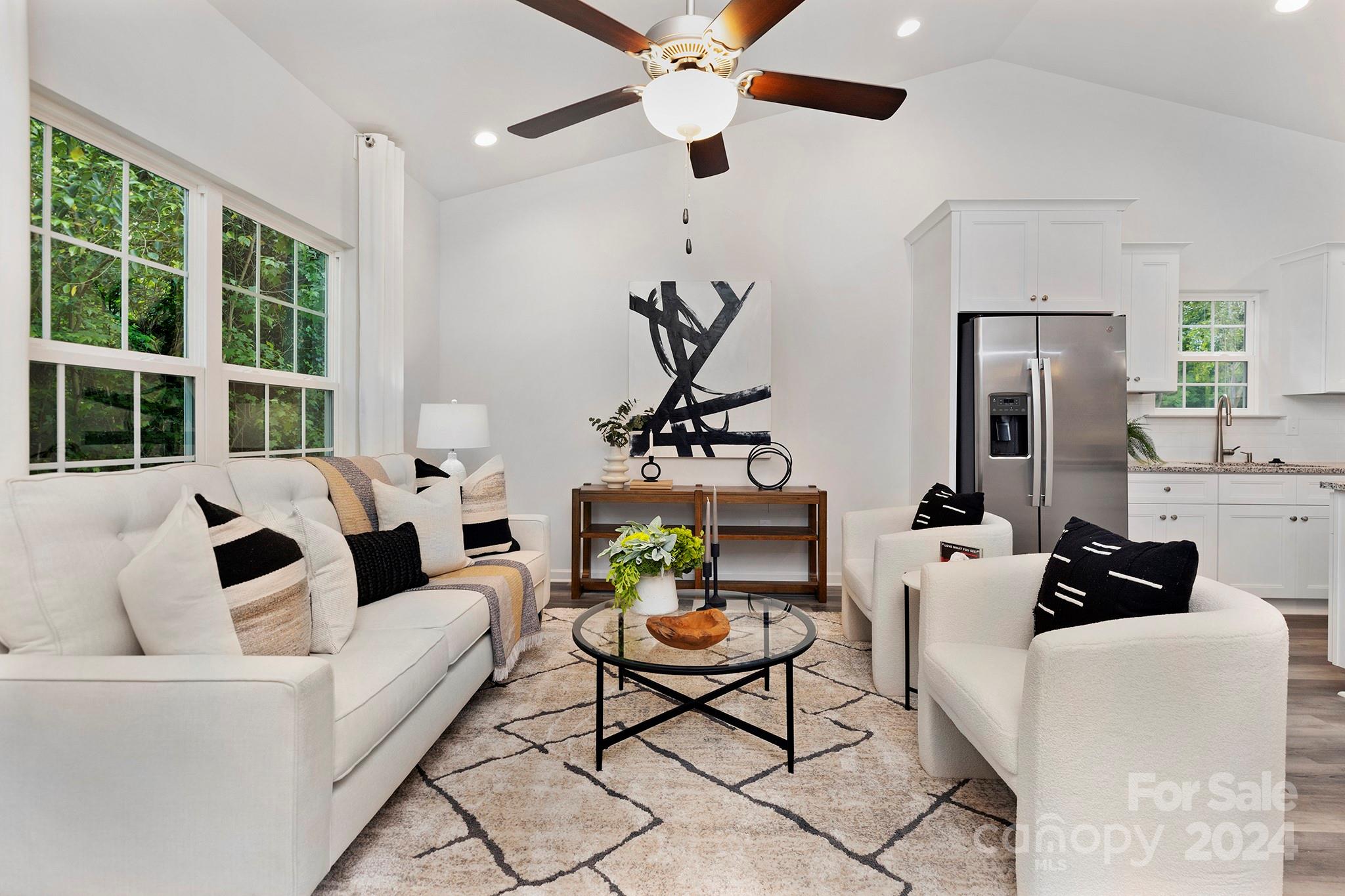 2150 Sunset Boulevard Charlotte, NC 28269 - Photo 6 of 23 a living room with furniture a chandelier and a window