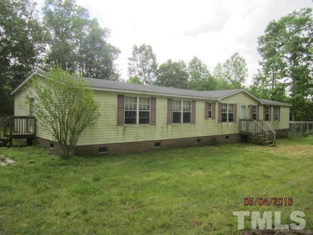 1492 Glenn Fogleman Road Rougemont, NC 27572 - Photo 1 of 24 a view of a house with a backyard