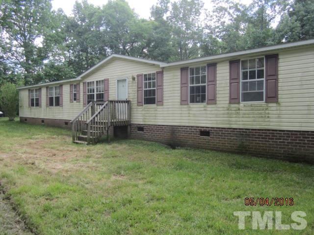 1492 Glenn Fogleman Road Rougemont, NC 27572 - Photo 2 of 24 a front view of a house with a yard