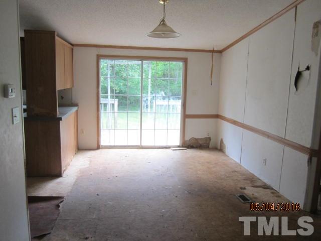 1492 Glenn Fogleman Road Rougemont, NC 27572 - Photo 14 of 24 a view of empty room with floor to ceiling window