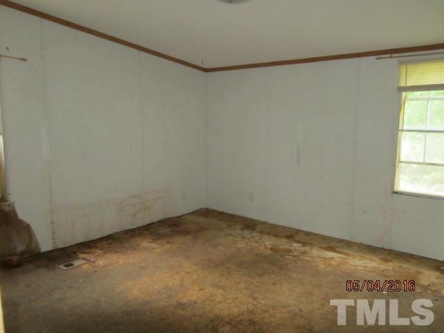 1492 Glenn Fogleman Road Rougemont, NC 27572 - Photo 15 of 24 an empty room with a window
