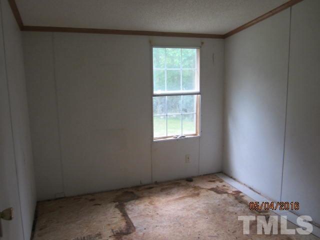 1492 Glenn Fogleman Road Rougemont, NC 27572 - Photo 17 of 24 an empty room with a window