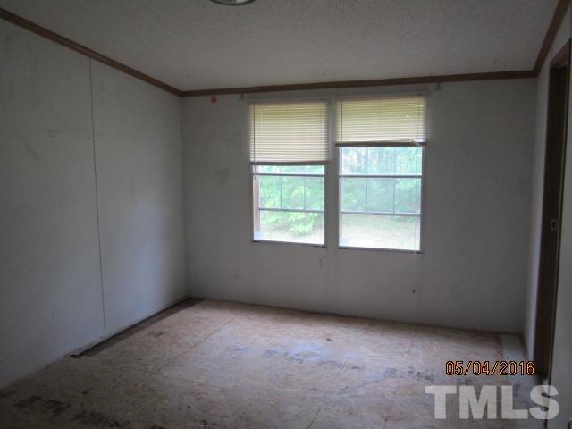1492 Glenn Fogleman Road Rougemont, NC 27572 - Photo 18 of 24 an empty room with a window