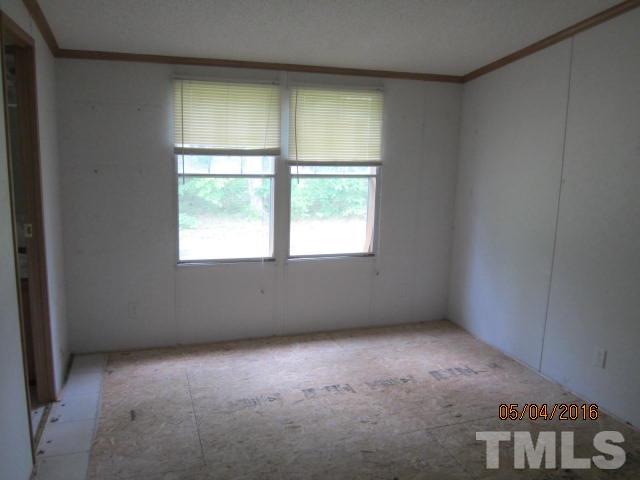 1492 Glenn Fogleman Road Rougemont, NC 27572 - Photo 19 of 24 an empty room with a window