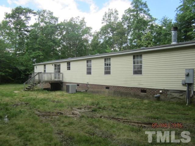 1492 Glenn Fogleman Road Rougemont, NC 27572 - Photo 3 of 24 a view of a house with a yard