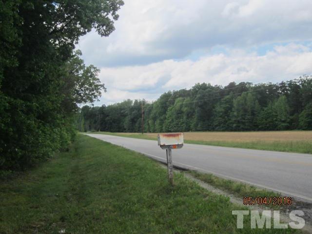 1492 Glenn Fogleman Road Rougemont, NC 27572 - Photo 24 of 24 a view of a green field with trees in the background