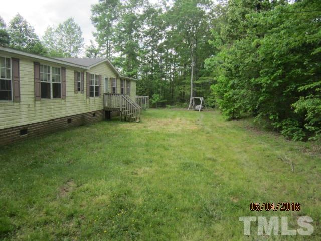 1492 Glenn Fogleman Road Rougemont, NC 27572 - Photo 4 of 24 a view of a house with backyard and sitting area