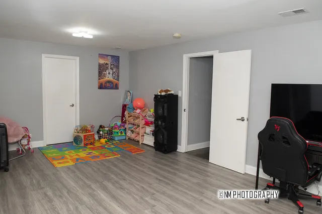 a room with furniture and wooden floor