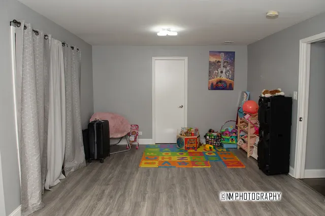 a room with toys and wooden floor