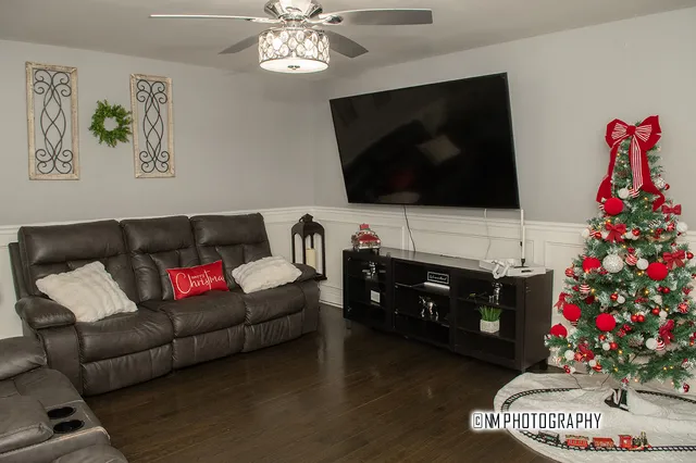 a living room with furniture and a flat screen tv