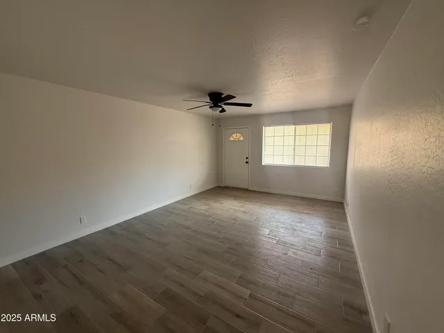 an empty room that has a window