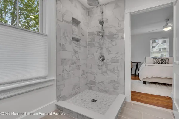 a bathroom with a shower and a sink