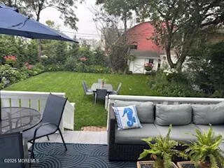 a view of a patio with couches table and chairs