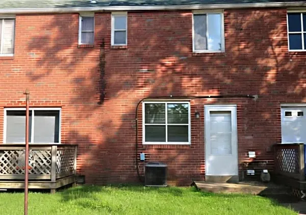 a view of front door of a house with yard