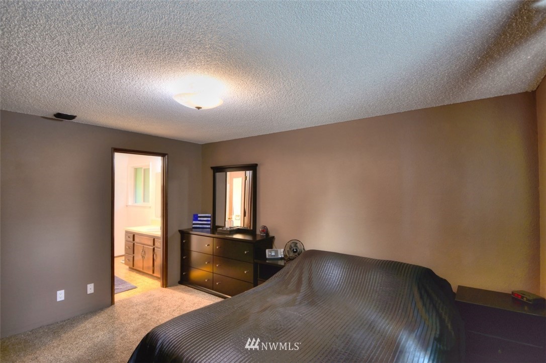 18233 Melon Court Southwest Rochester, WA 98579 - Photo 14 of 25 a living room with a couch
