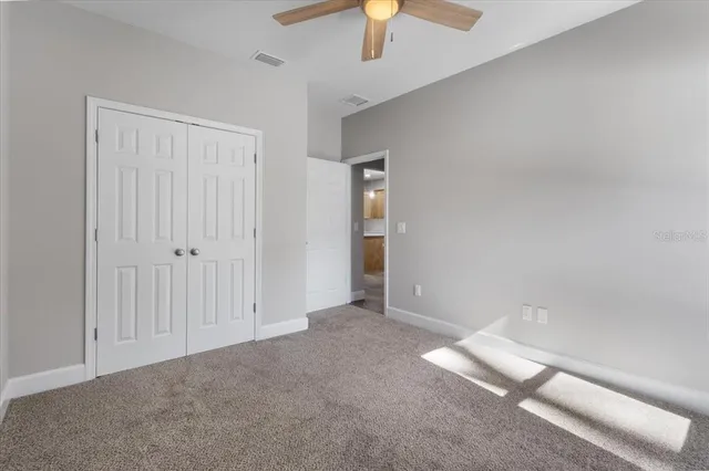 a view of a pathway both side of house