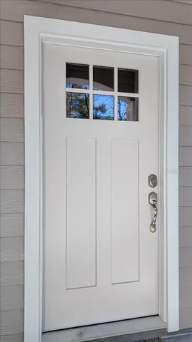 a view of a wooden house with a yard