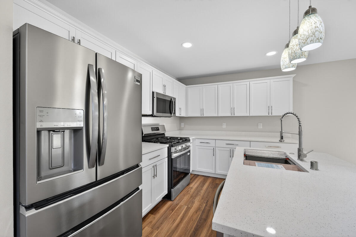 1619 Derby Avenue Mount Pleasant, WI 53403 - Photo 6 of 27 White cabinetry & quartz counters
