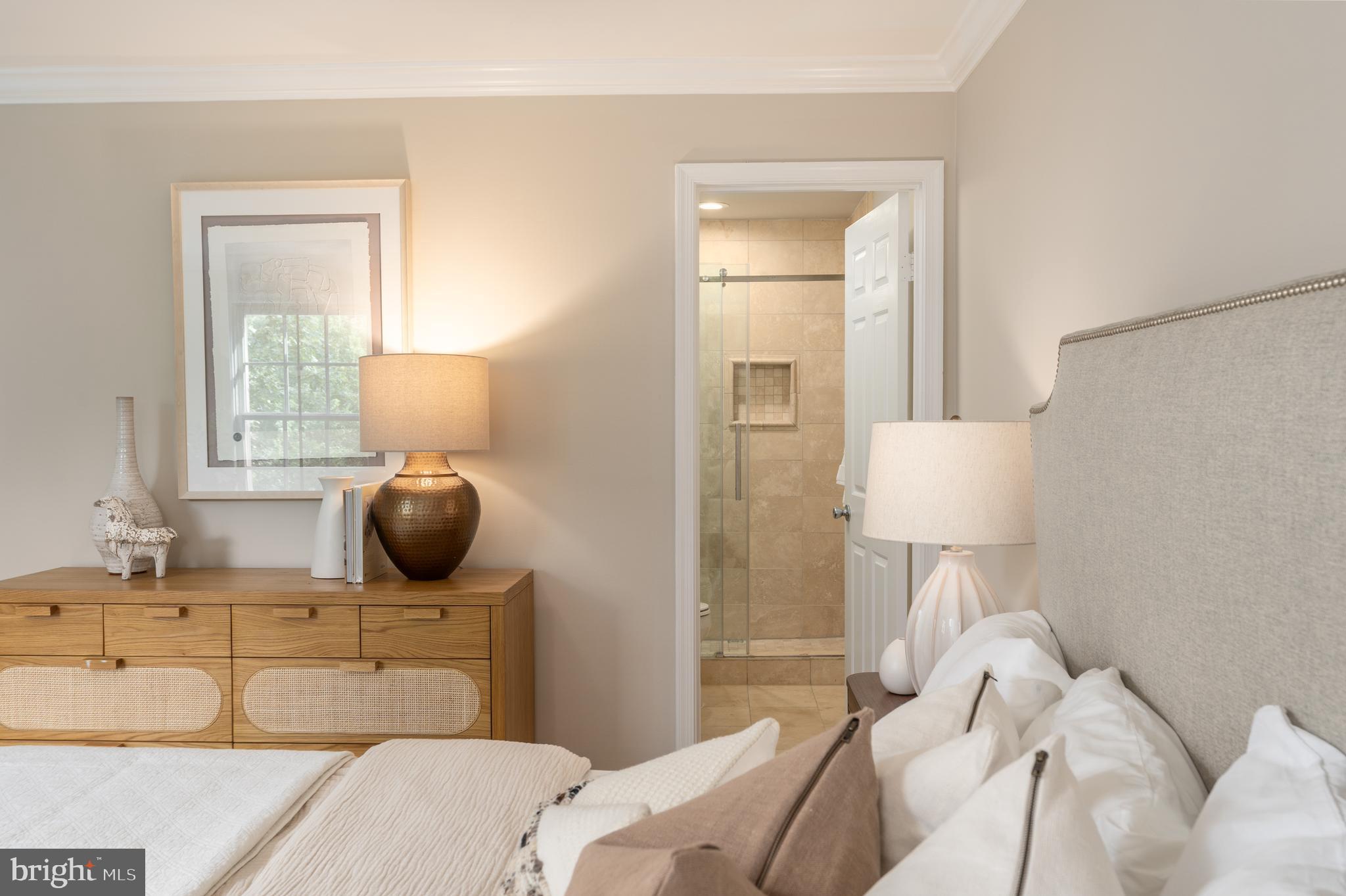 3299 Sutton Place Northwest, Unit C Washington, DC 20016 - Photo 25 of 40 a bedroom with a bed and a lamp