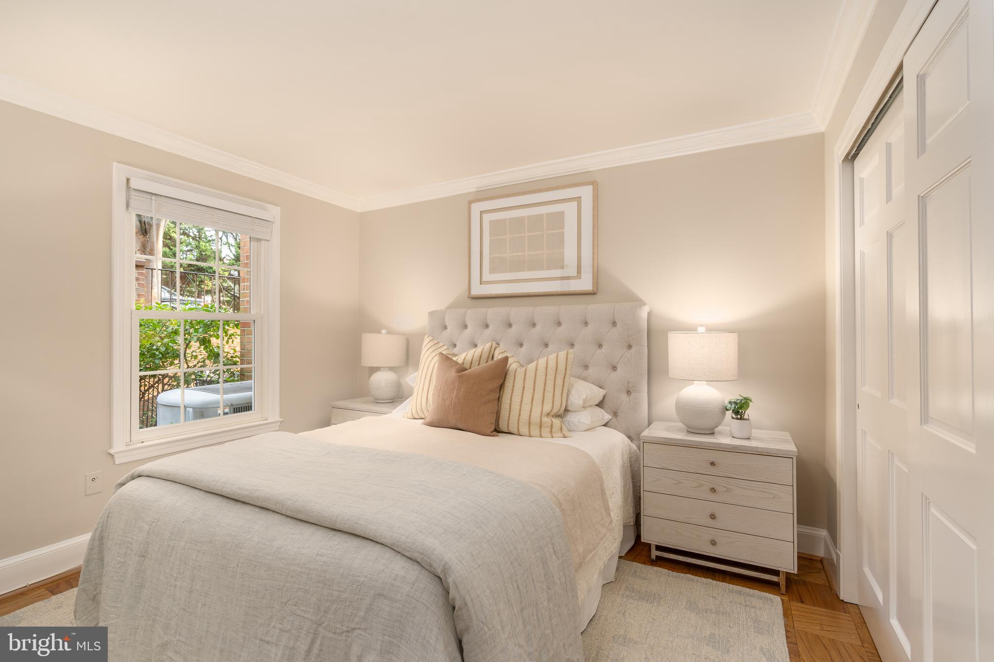 3299 Sutton Place Northwest, Unit C Washington, DC 20016 - Photo 27 of 40 a bedroom with a bed and a window