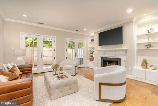 a living room with furniture fireplace and a flat screen tv