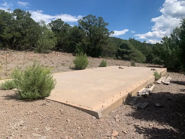 a view of a backyard of the house