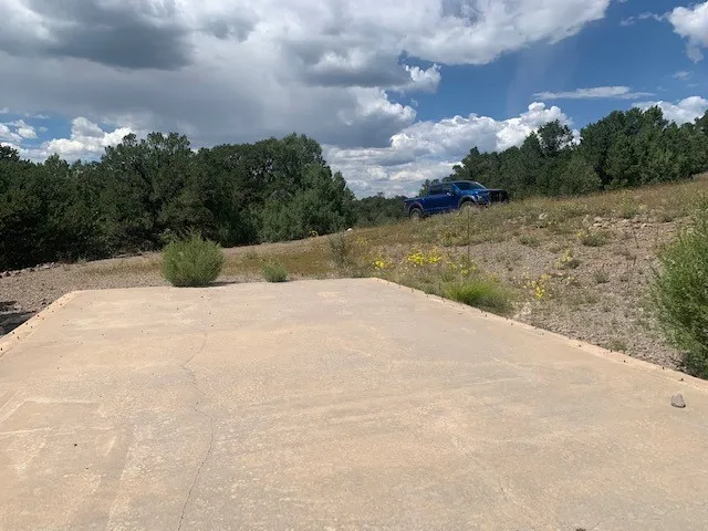 a view of white house with a yard