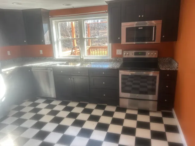 a room with a black white checkered floor with a black white checkered floor