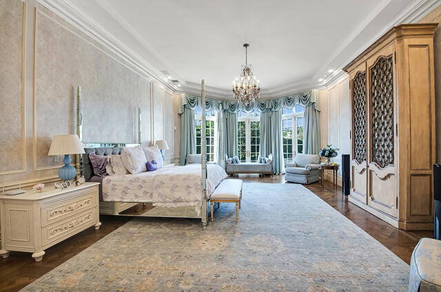 17791 Saxony Court Boca Raton, FL 33496 - Photo 10 of 41 a spacious bedroom with bed and a chandelier