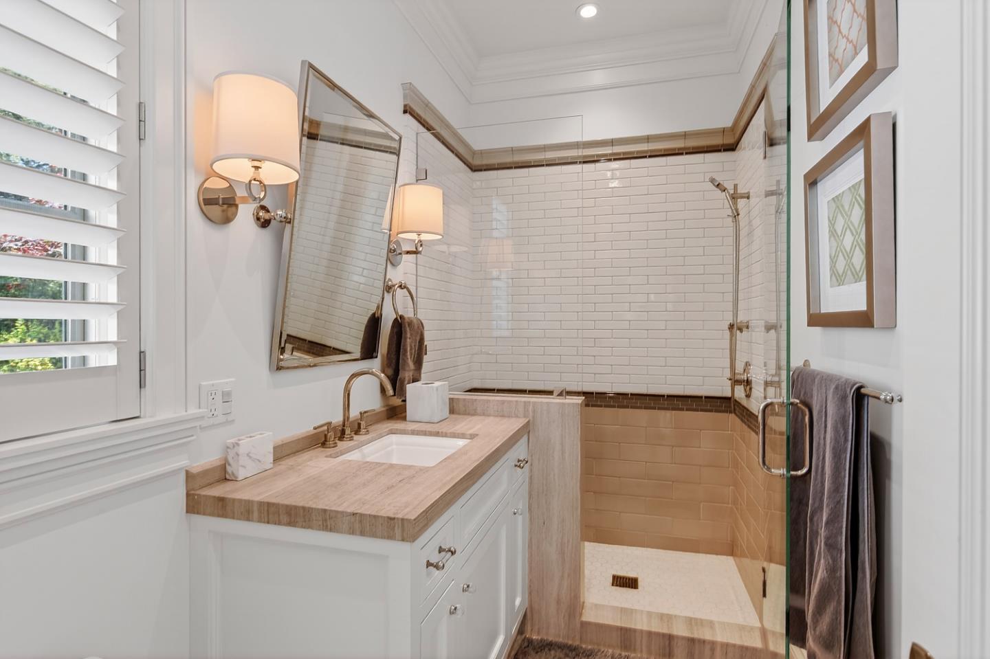 351 Walsh Road Atherton, CA 94027 - Photo 52 of 65 a bathroom with a sink and a mirror