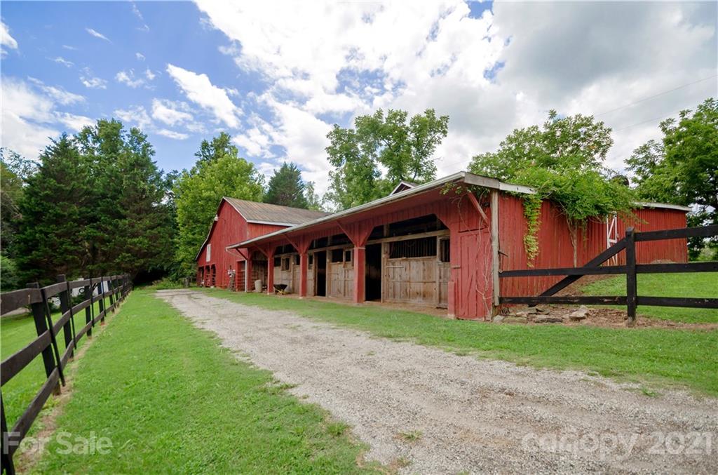 3379 Polk County Line Road Rutherfordton, NC 28139 - Photo 22 of 36 a view of a house with yard and a garden
