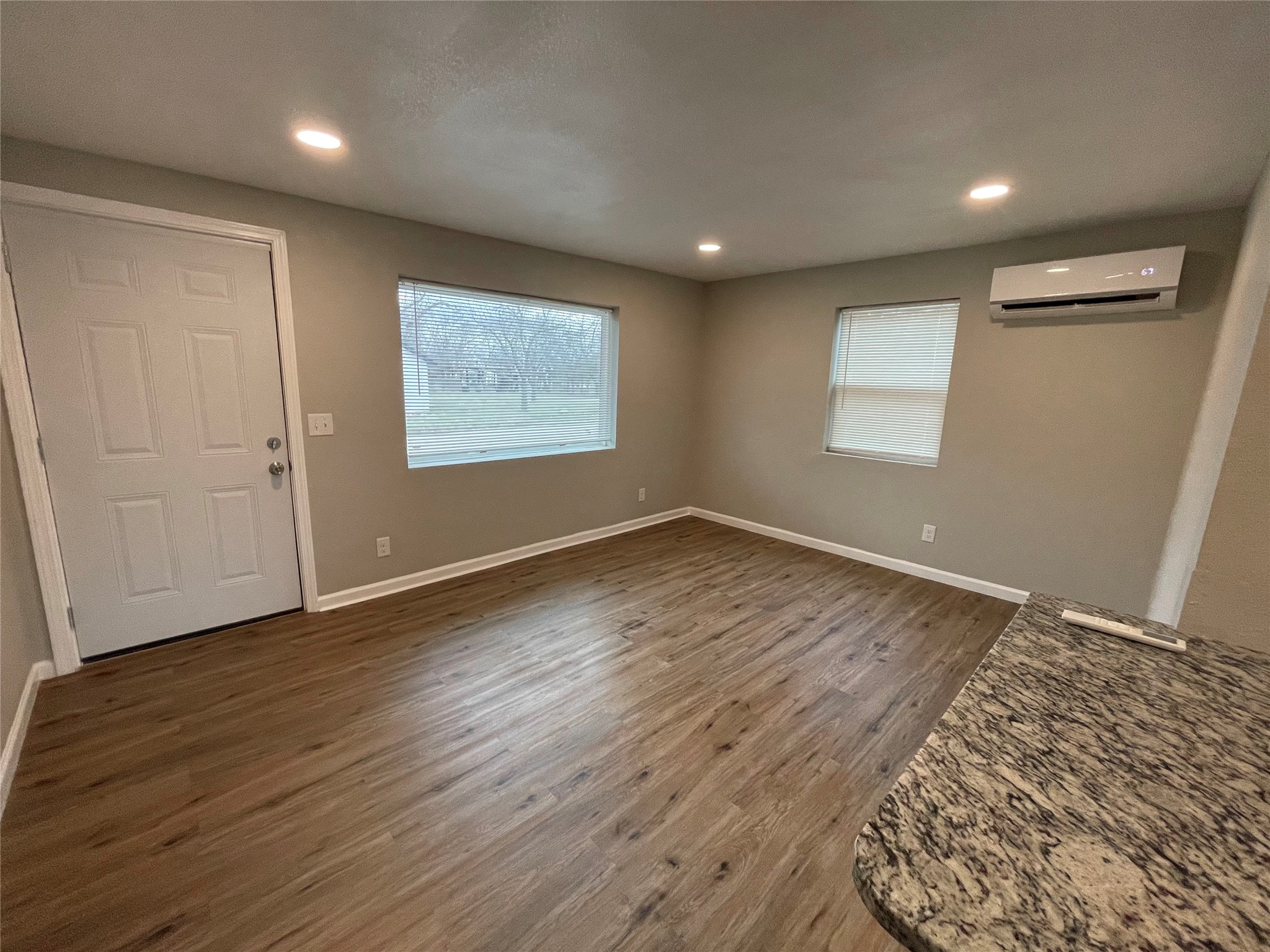 809 South Pierce Street Burnet, TX 78611 - Photo 6 of 7 Entrance foyer with dark wood-type flooring and recessed lighting